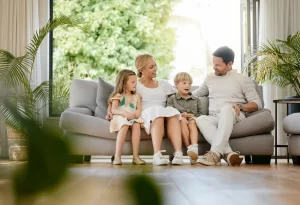 Full Body Young Smiling Caucasian Family Embracing